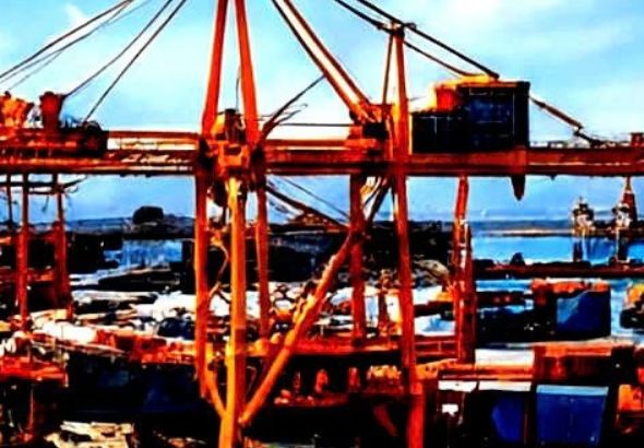Port cranes at Gwadar against a blue sky